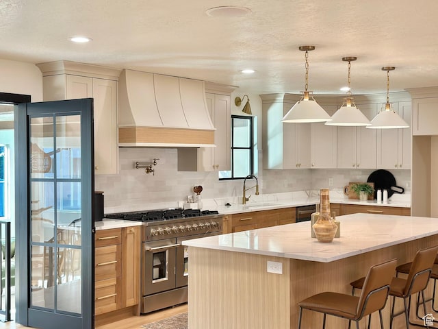 5862 S Ayrshire Dr, Murray, UT 84107 - kitchen featuring premium range hood, double oven range, decorative backsplash, light stone counters, and a textured ceiling