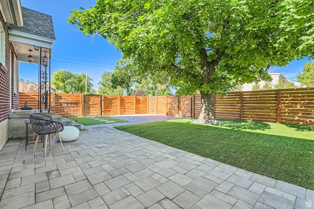 293 E 4800 S, Murray, UT 84107 - fenced backyard with a patio area