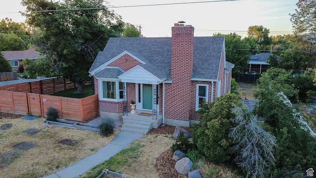 293 E 4800 S, Murray, UT 84107 - view of front facade featuring a chimney and roof with shingles