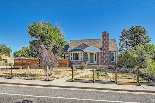 293 E 4800 S, Murray, UT 84107 - bungalow with a chimney, roof with shingles, and brick siding