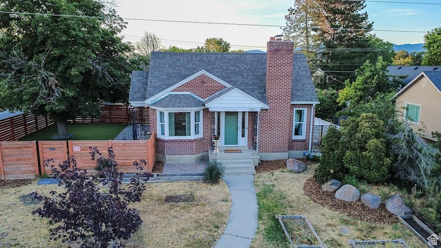 293 E 4800 S, Murray, UT 84107 - view of front of property featuring a chimney, a shingled roof, and brick siding