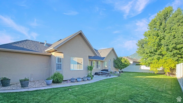 1812 E 1460 S, Spanish Fork, UT 84660 - rear view of house featuring stucco siding, a fenced backyard, a patio, and a shingled roof