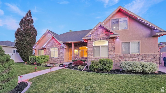1812 E 1460 S, Spanish Fork, UT 84660 - view of front facade with stone siding, a front lawn, and stucco siding