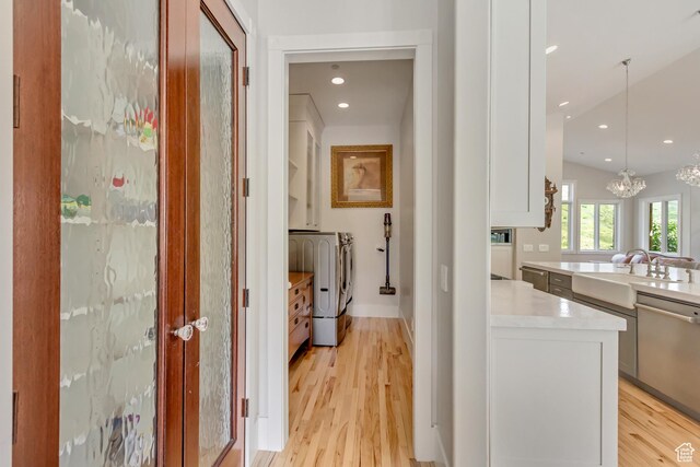 370 S Got Teeth Ln E, Emigration Canyon, UT 84108 - hallway with washer and dryer, light wood finished floors, a chandelier, and recessed lighting