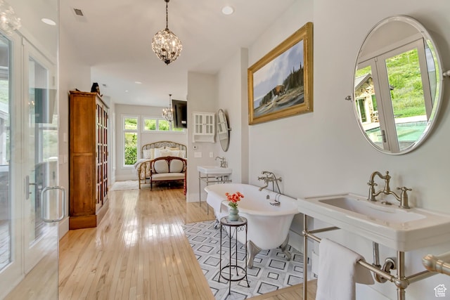 370 S Got Teeth Ln E, Emigration Canyon, UT 84108 - hall with a chandelier, light wood finished floors, french doors, and recessed lighting
