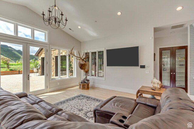 370 S Got Teeth Ln E, Emigration Canyon, UT 84108 - living room with french doors, a chandelier, wood finished floors, recessed lighting, and high vaulted ceiling