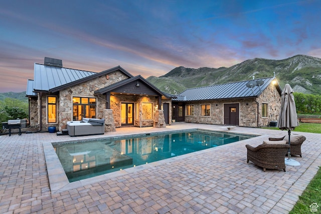 370 S Got Teeth Ln E, Emigration Canyon, UT 84108 - pool at dusk with a patio area, an outdoor pool, and a mountain view