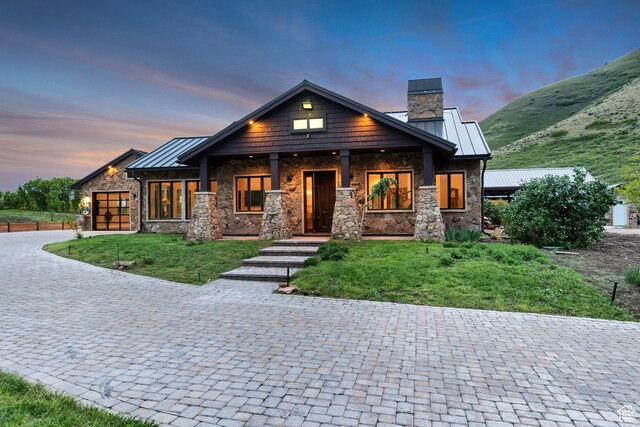 370 S Got Teeth Ln E, Emigration Canyon, UT 84108 - view of front facade with stone siding, a standing seam roof, and a chimney