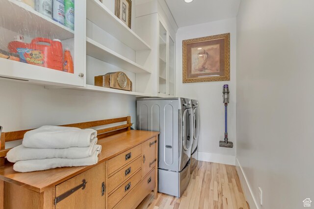 370 S Got Teeth Ln E, Emigration Canyon, UT 84108 - laundry area with washer and dryer, light wood finished floors, and cabinet space