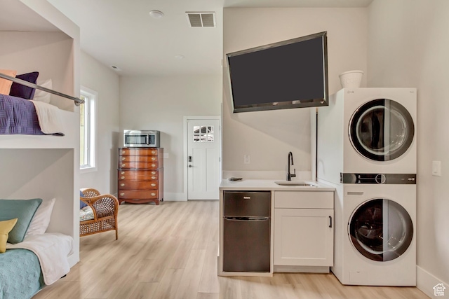 370 S Got Teeth Ln E, Emigration Canyon, UT 84108 - washroom with estacked washer and dryer and light wood-style flooring