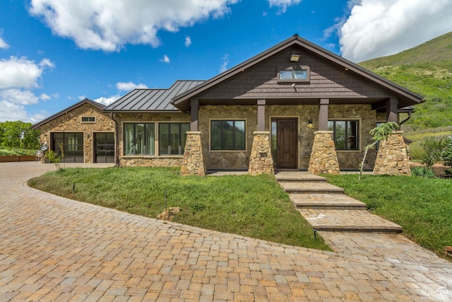 370 S Got Teeth Ln E, Emigration Canyon, UT 84108 - craftsman-style home featuring stone siding, a standing seam roof, a front lawn, and a metal roof