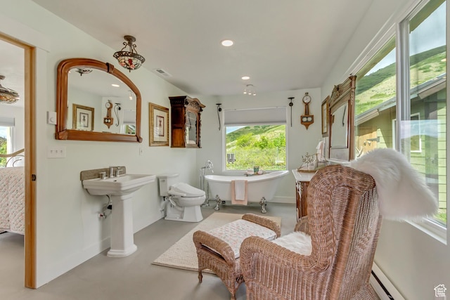 370 S Got Teeth Ln E, Emigration Canyon, UT 84108 - full bathroom with a soaking tub, a baseboard radiator, recessed lighting, and concrete flooring