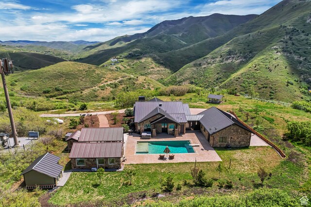 370 S Got Teeth Ln E, Emigration Canyon, UT 84108 - aerial view of property and surrounding area with a pool and a mountain backdrop