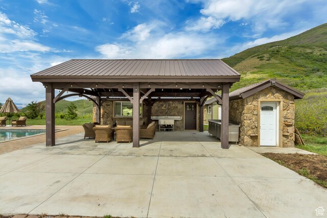370 S Got Teeth Ln E, Emigration Canyon, UT 84108 - view of patio with a gazebo, an outdoor hangout area, an outdoor pool, and a mountain view
