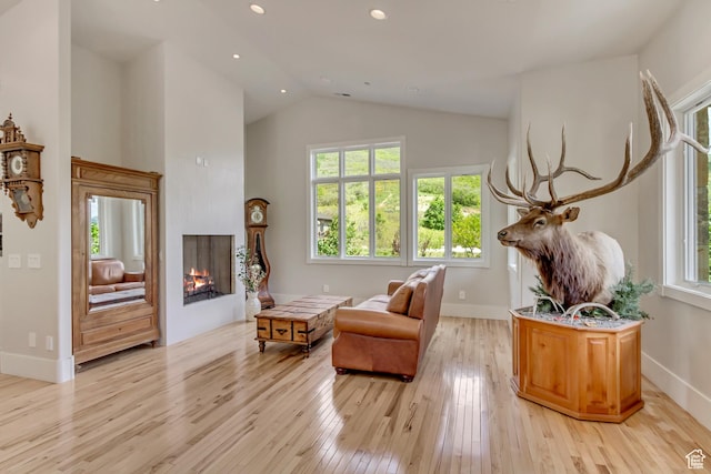 370 S Got Teeth Ln E, Emigration Canyon, UT 84108 - sitting room featuring light wood-style floors, high vaulted ceiling, a warm lit fireplace, and recessed lighting
