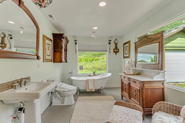 370 S Got Teeth Ln E, Emigration Canyon, UT 84108 - bathroom with concrete floors, plenty of natural light, a freestanding tub, and recessed lighting