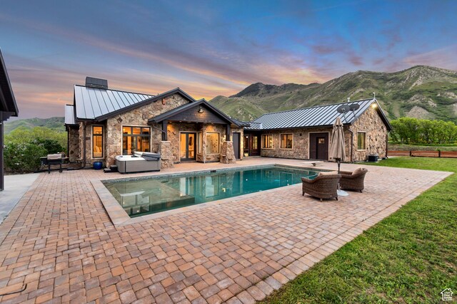 370 S Got Teeth Ln E, Emigration Canyon, UT 84108 - outdoor pool featuring a hot tub, a patio, a mountain view, and a diving board