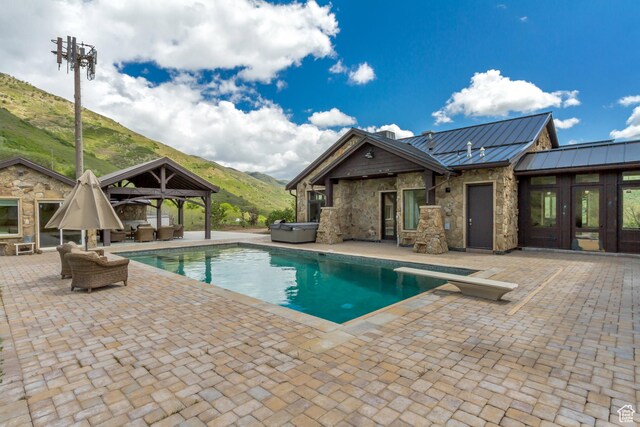 370 S Got Teeth Ln E, Emigration Canyon, UT 84108 - swimming pool with a gazebo, a hot tub, an outdoor living space, a mountain view, and a patio