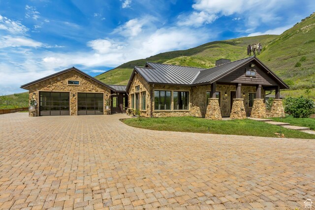 370 S Got Teeth Ln E, Emigration Canyon, UT 84108 - view of front facade with a standing seam roof, stone siding, an attached garage, and a mountain view