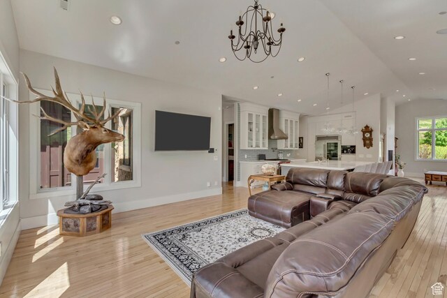 370 S Got Teeth Ln E, Emigration Canyon, UT 84108 - living area featuring light wood finished floors, lofted ceiling, a chandelier, and recessed lighting