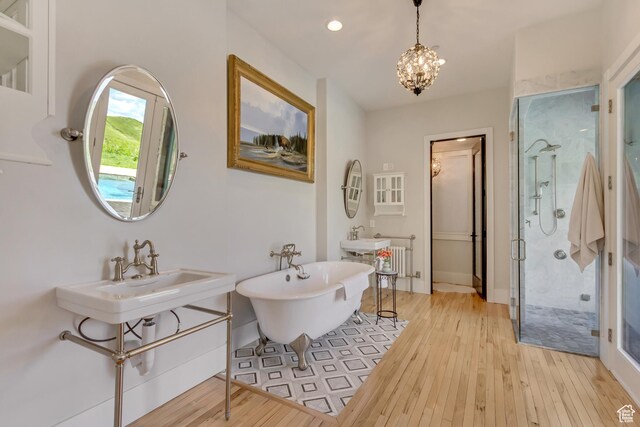 370 S Got Teeth Ln E, Emigration Canyon, UT 84108 - full bathroom featuring a shower stall, hardwood / wood-style flooring, a freestanding tub, a chandelier, and recessed lighting