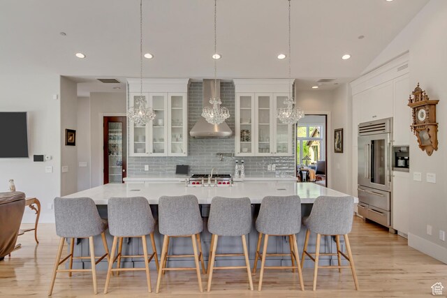 370 S Got Teeth Ln E, Emigration Canyon, UT 84108 - kitchen featuring a chandelier, high quality fridge, decorative backsplash, white cabinets, and recessed lighting