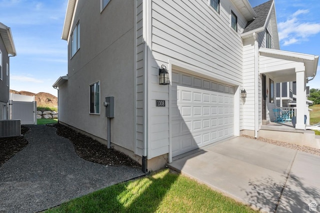 1308 E Daffodil Ct Unit 150, Layton, UT 84040 - view of home's exterior with a garage and covered porch