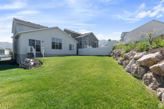 1308 E Daffodil Ct Unit 150, Layton, UT 84040 - rear view of house featuring stucco siding