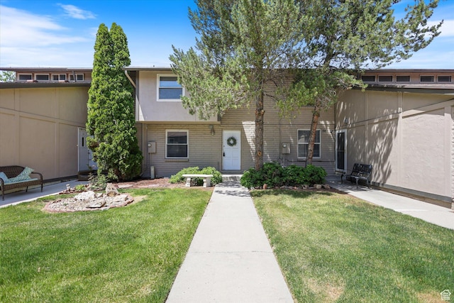 55 W San Rafael Ct S, West Jordan, UT 84088 - townhome / multi-family property with a front lawn and brick siding