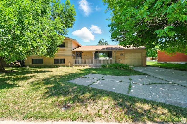 1188 N 600 E, Logan, UT 84341 - split level home with brick siding, driveway, a garage, and a front yard