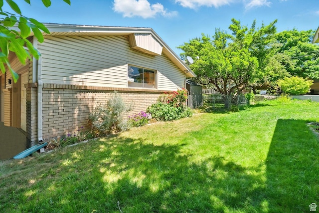 1188 N 600 E, Logan, UT 84341 - view of side of home with brick siding