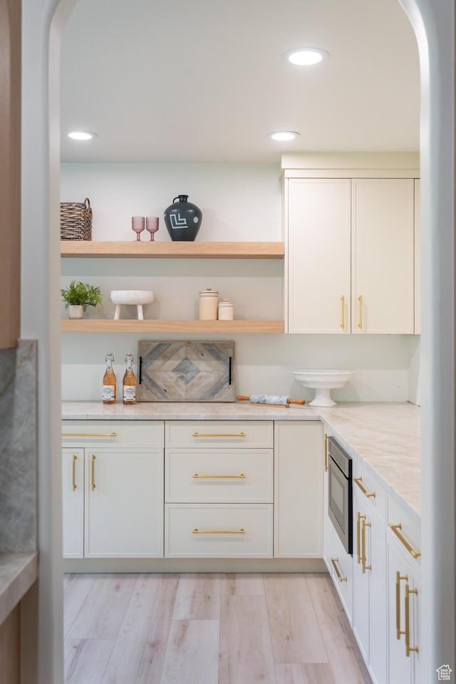 2795 E Palma Way, Cottonwood Heights, UT 84121 - kitchen featuring arched walkways, open shelves, recessed lighting, and white cabinets