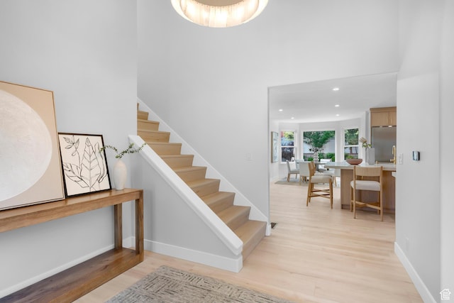 2795 E Palma Way, Cottonwood Heights, UT 84121 - stairs with wood finished floors, a towering ceiling, and recessed lighting
