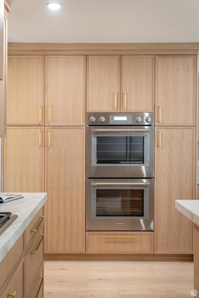 2795 E Palma Way, Cottonwood Heights, UT 84121 - kitchen featuring double oven, light brown cabinetry, light wood-type flooring, and light countertops