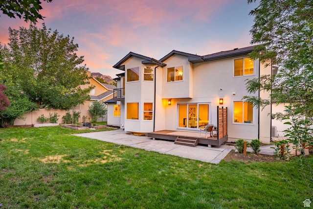 2795 E Palma Way, Cottonwood Heights, UT 84121 - back of property with a patio, stucco siding, a wooden deck, and a garden
