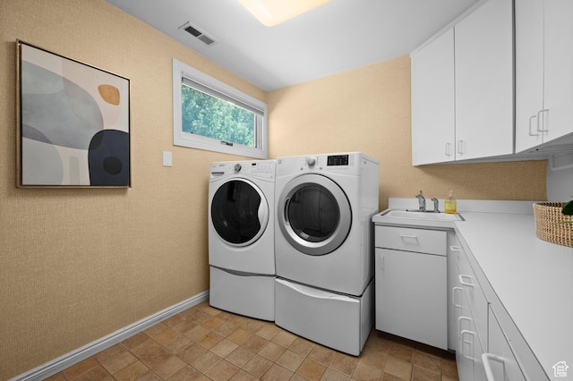 5757 S Holladay Blvd E, Holladay, UT 84121 - laundry area featuring washer and clothes dryer and cabinet space