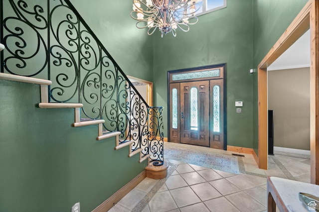 5757 S Holladay Blvd E, Holladay, UT 84121 - entryway with a chandelier, a towering ceiling, plenty of natural light, stairs, and tile patterned flooring