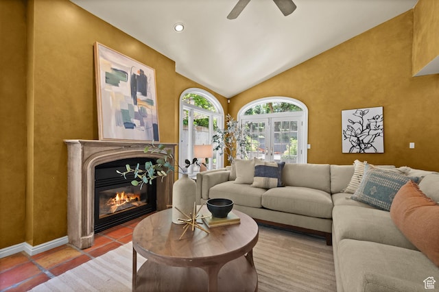 5757 S Holladay Blvd E, Holladay, UT 84121 - living area featuring a glass covered fireplace, vaulted ceiling, and ceiling fan