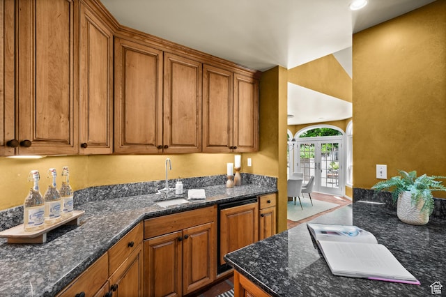 5757 S Holladay Blvd E, Holladay, UT 84121 - kitchen with brown cabinetry and dark stone countertops