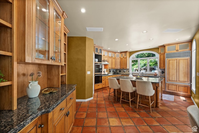 5757 S Holladay Blvd E, Holladay, UT 84121 - kitchen with a breakfast bar, backsplash, recessed lighting, a center island, and open shelves