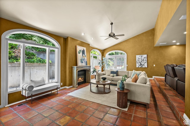 5757 S Holladay Blvd E, Holladay, UT 84121 - living area with plenty of natural light, a ceiling fan, a glass covered fireplace, lofted ceiling, and recessed lighting