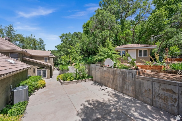 5757 S Holladay Blvd E, Holladay, UT 84121 - view of patio / terrace featuring basketball hoop