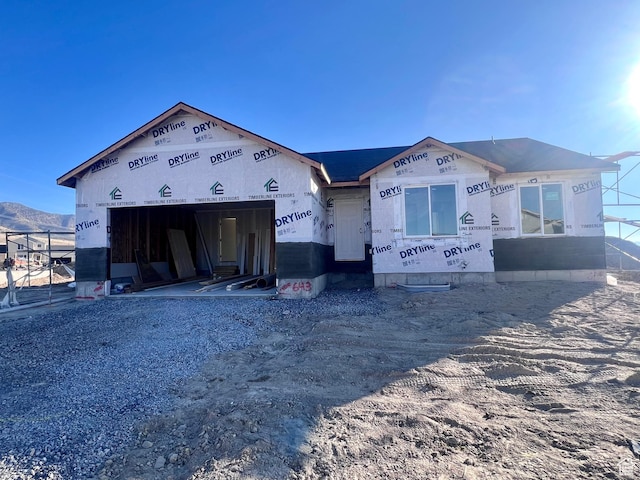 2352 E Blossom St, Eagle Mountain, UT 84005 - unfinished property with a garage and gravel driveway