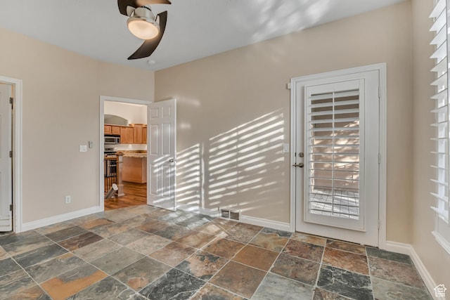 9656 Villa Springs Cv, Sandy, UT 84070 - interior space with stone tile floors and ceiling fan