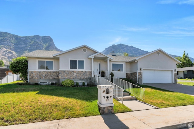 2522 N 1000 E, Provo, UT 84604 - ranch-style home with stone siding, stucco siding, a mountain view, and a garage