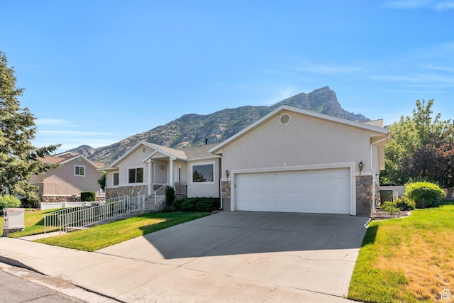 2522 N 1000 E, Provo, UT 84604 - single story home with stone siding, stucco siding, a mountain view, and an attached garage