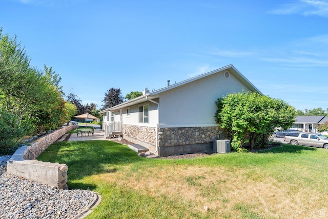 2522 N 1000 E, Provo, UT 84604 - view of side of home with stone siding, stucco siding, and a lawn
