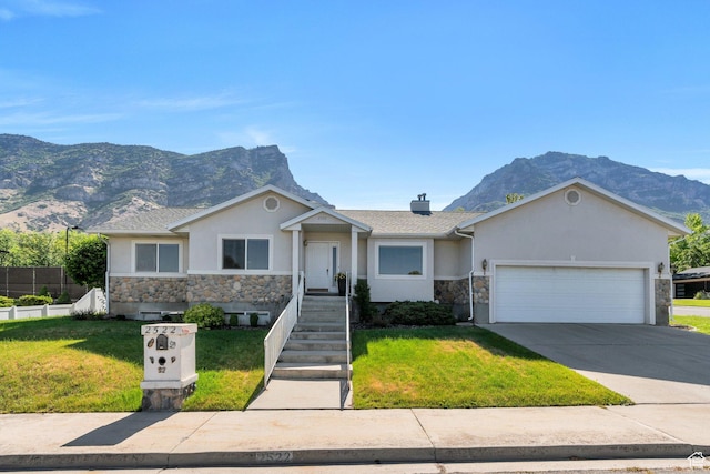 2522 N 1000 E, Provo, UT 84604 - ranch-style house featuring stucco siding, stone siding, a mountain view, and an attached garage