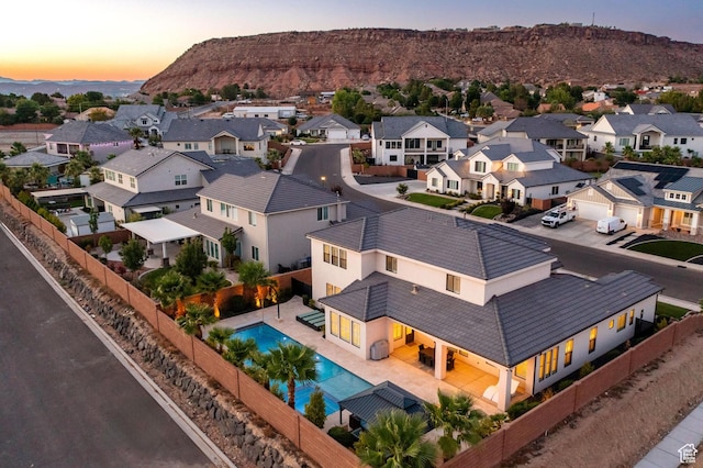 2530 S Monterosa Ln, St George, UT 84790 - aerial view of residential area with a pool and a mountainous background
