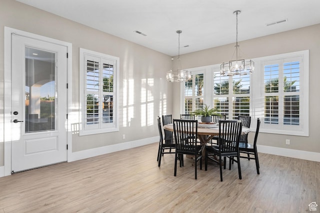 2530 S Monterosa Ln, St George, UT 84790 - dining space featuring a chandelier, light wood-type flooring, and plenty of natural light